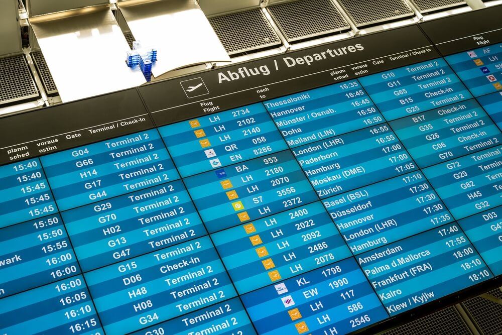 Flight board with cancellations and delays at Munich airport 