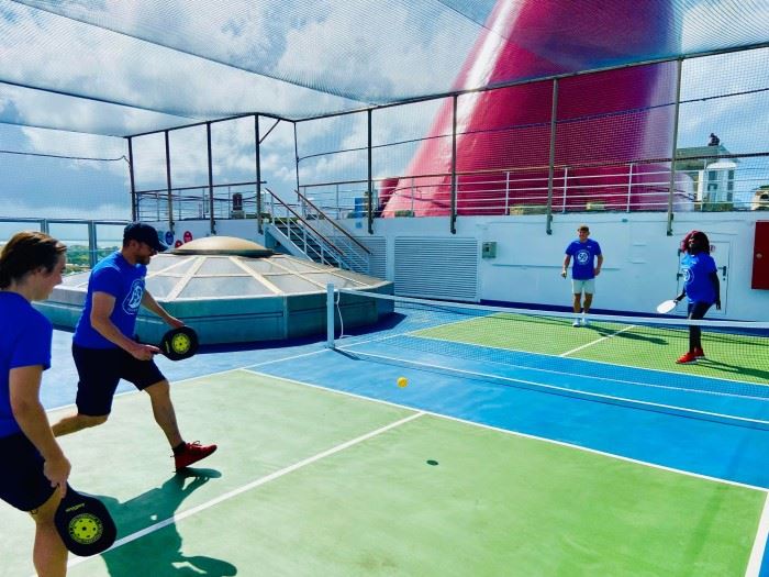 carnival cruisers playing pickleball on carnival conquest
