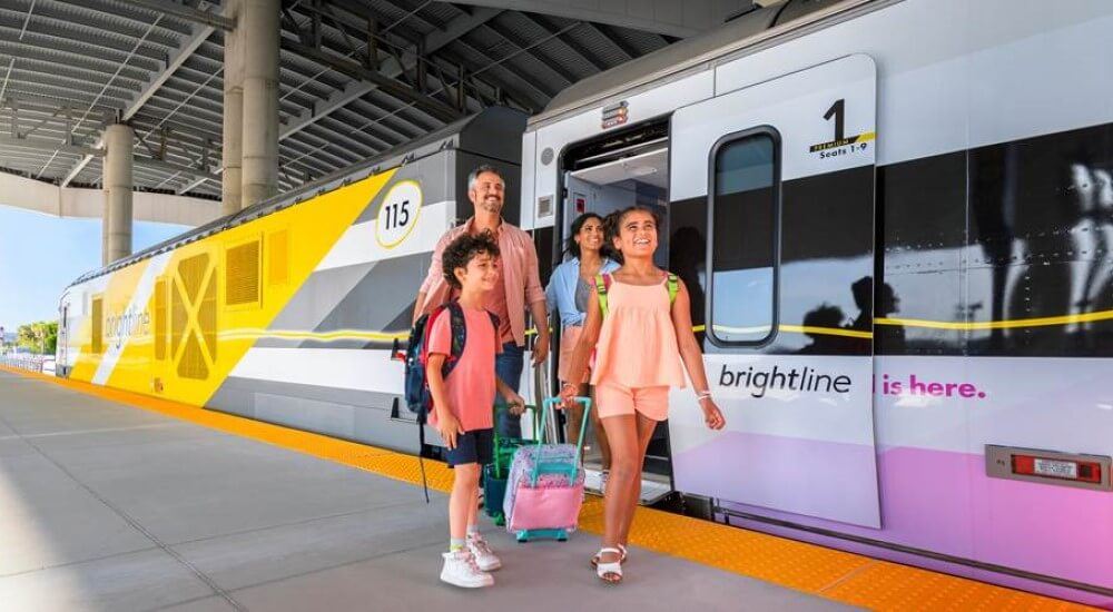 family getting off a Brightline train in orlando