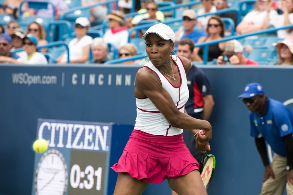 Venus Williams playing at US Open hitting a backhand 