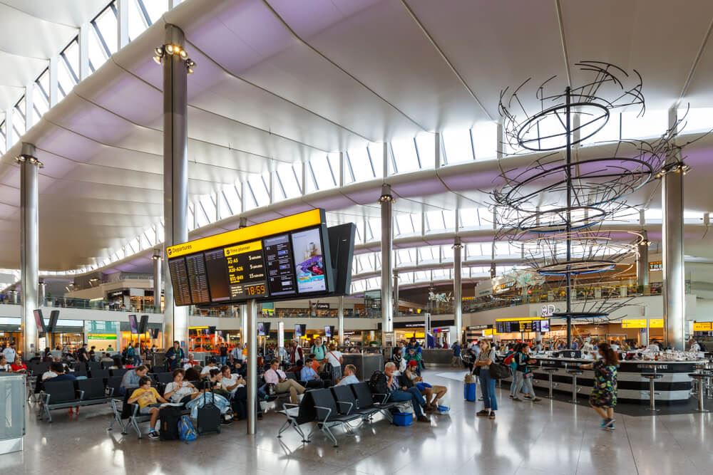 London heathrow airport with people inside the terminal 