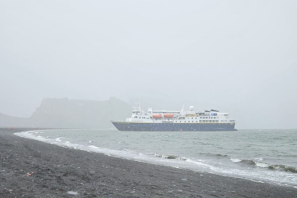 lindblad expeditions' national geographic explorer at deception island in antarctica