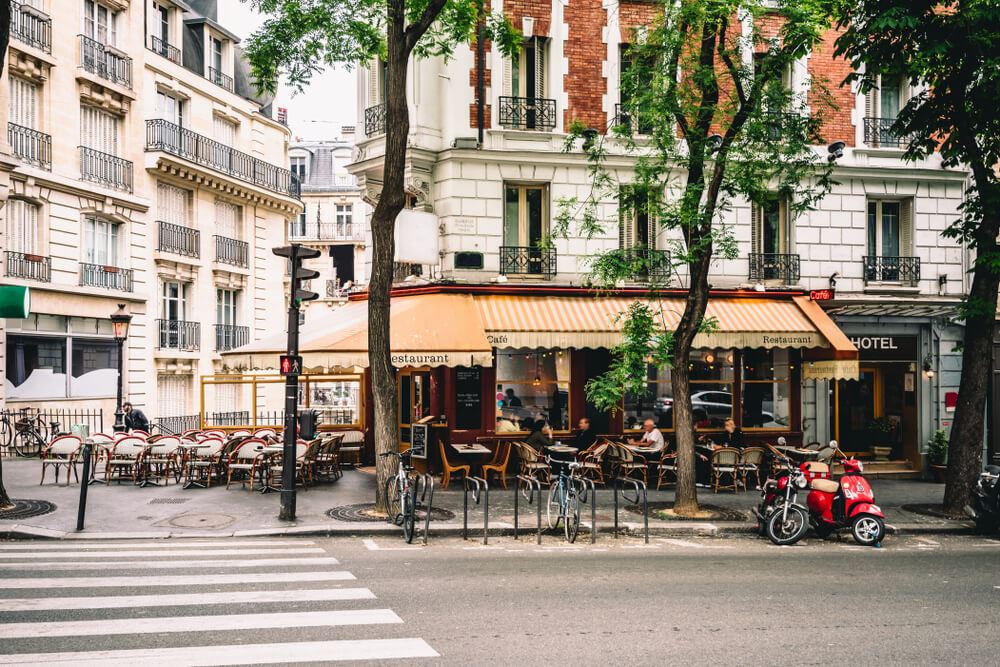 People eating at a small cafe in Paris 