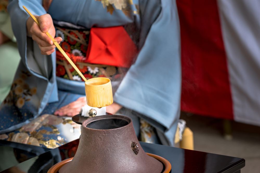 Japanese woman in kimono is preparing green tea which call the Japanese tea ceremony.