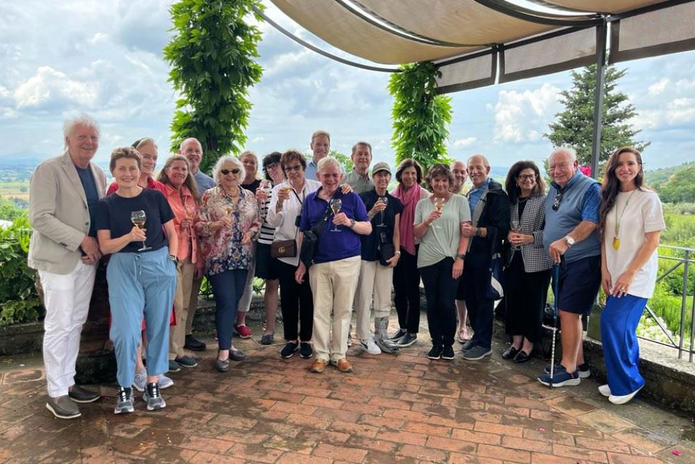 Frances Mayes poses with a Tauck tour group in Cortona, Italy