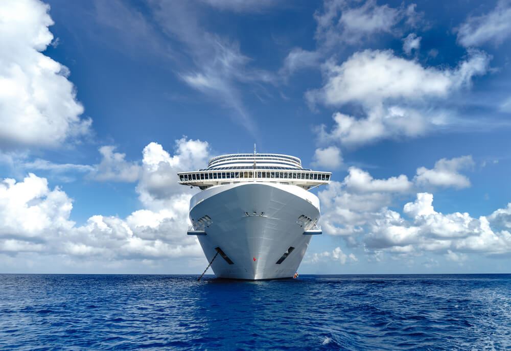 two cruise ships docked next to each other