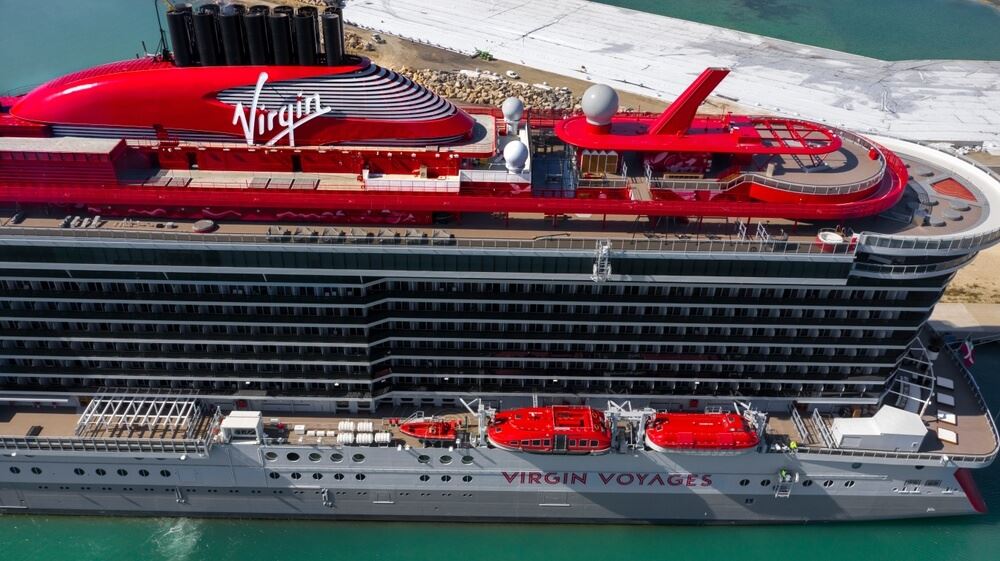 Virgin voyages ship aerial view with logo out front 
