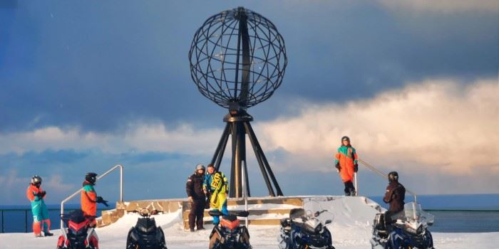 tourists on a snowmobile excursion to the North Cape of Norway