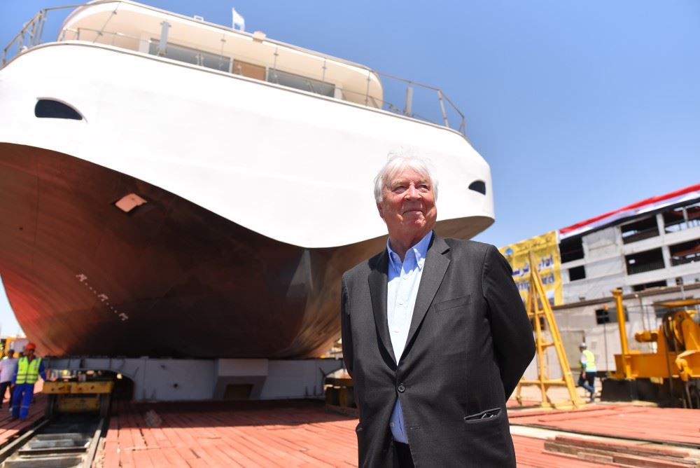 viking chairman torstein hagen standing in front of viking aton as it is floated out