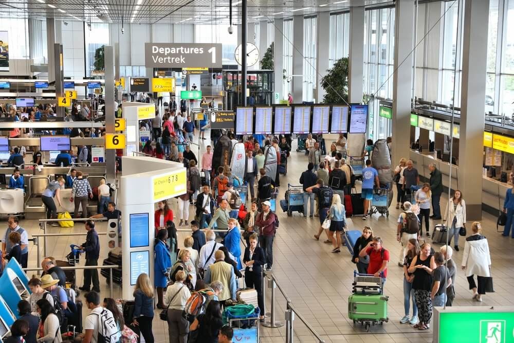 busy airport terminal with lots of travelers 