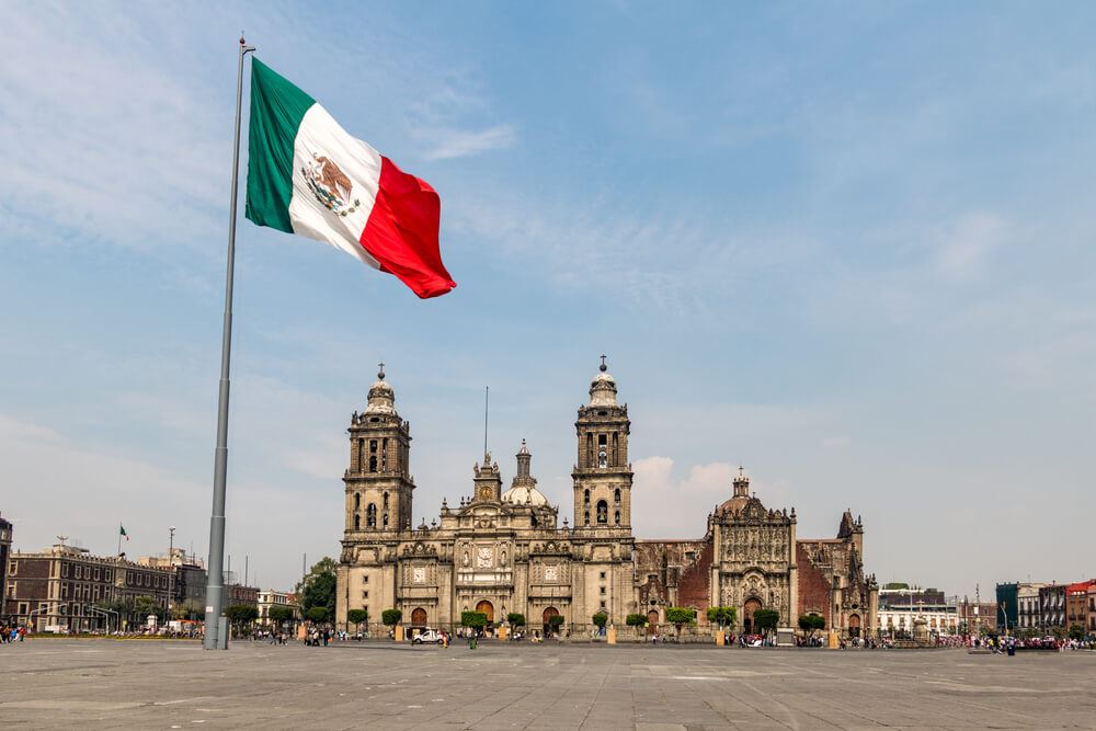 Mexico flag flying outside of country capital 