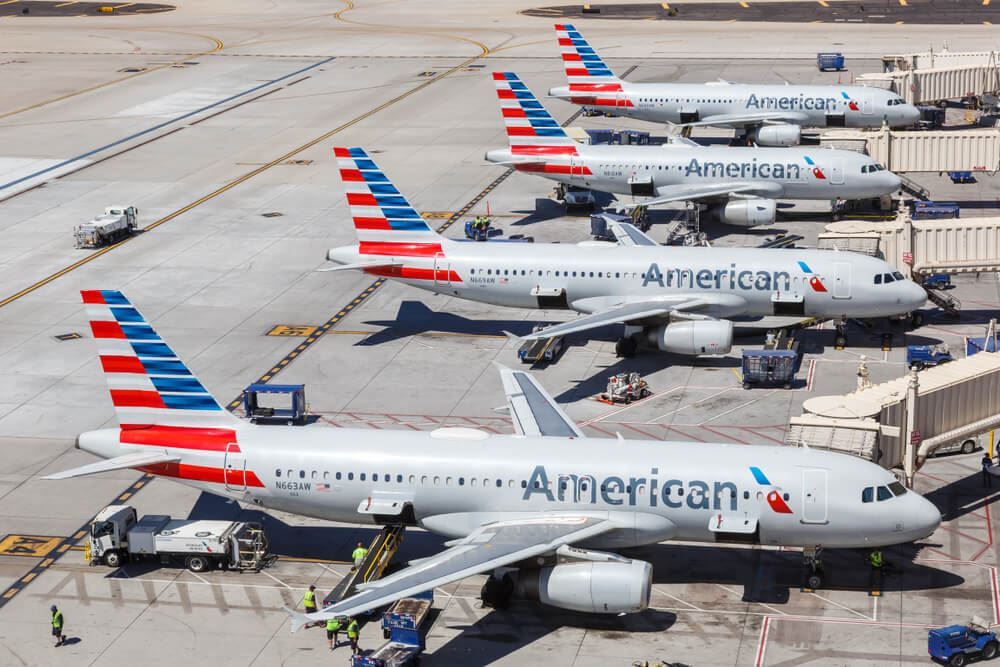 American Airlines planes on runway waiting to takeoff 