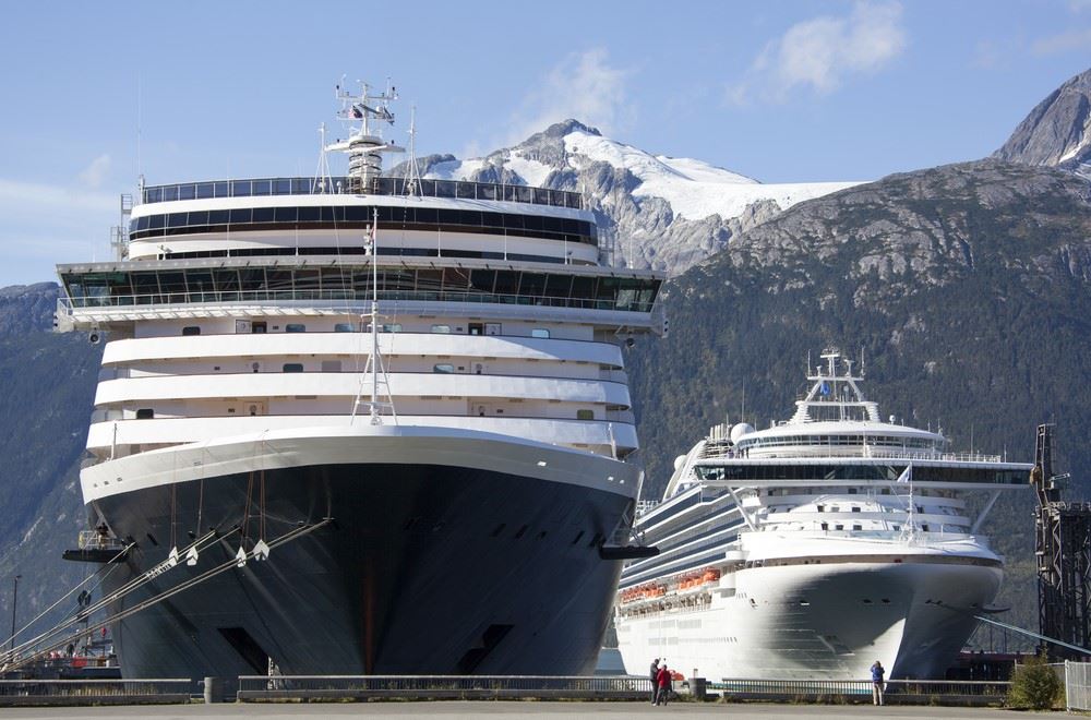two cruise ships docked next to each other in alaska