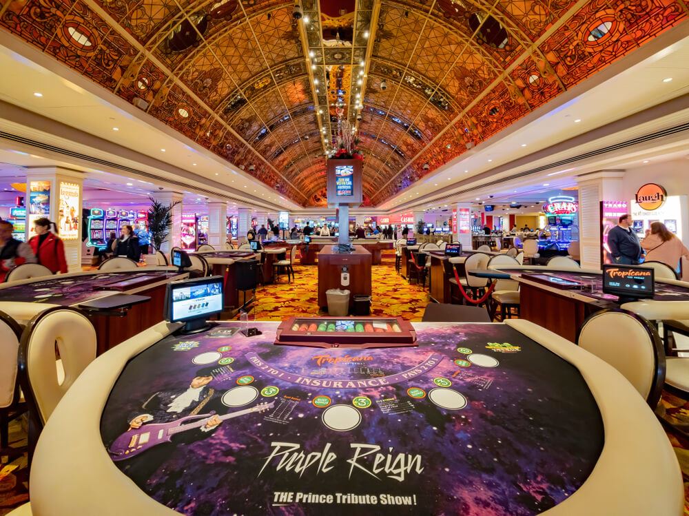Inside the Tropicana Casino in Las vegas with blackjack table and Purple Reign advertisement 