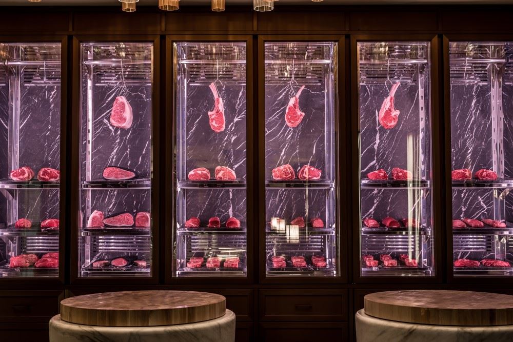 cuts of meat hanging at the beefbar restaurant in monaco