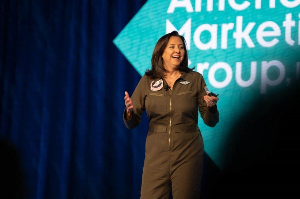 dondra ritzenthaler dressed in a top gun outfit at american marketing group conference