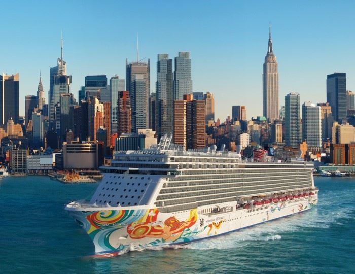 norwegian getaway cruise ship departing from new york city with skyline in background