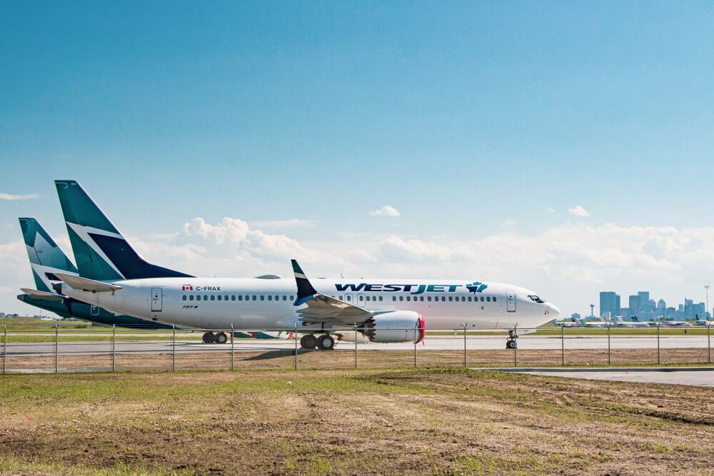 WestJet Planes parked on runway Toronto 