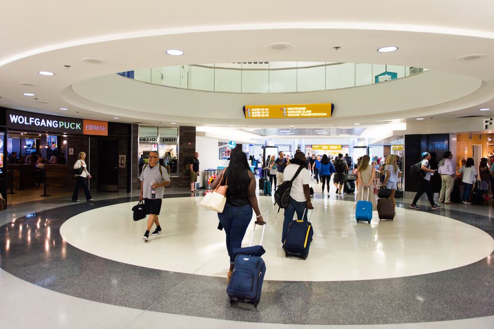 Passengers walking through LAX International Airport 