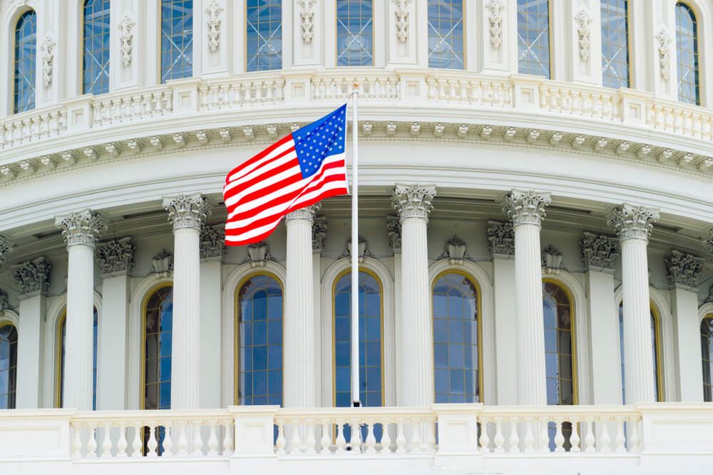 U.S. flag flying in front of the U.S. House of Representatives 