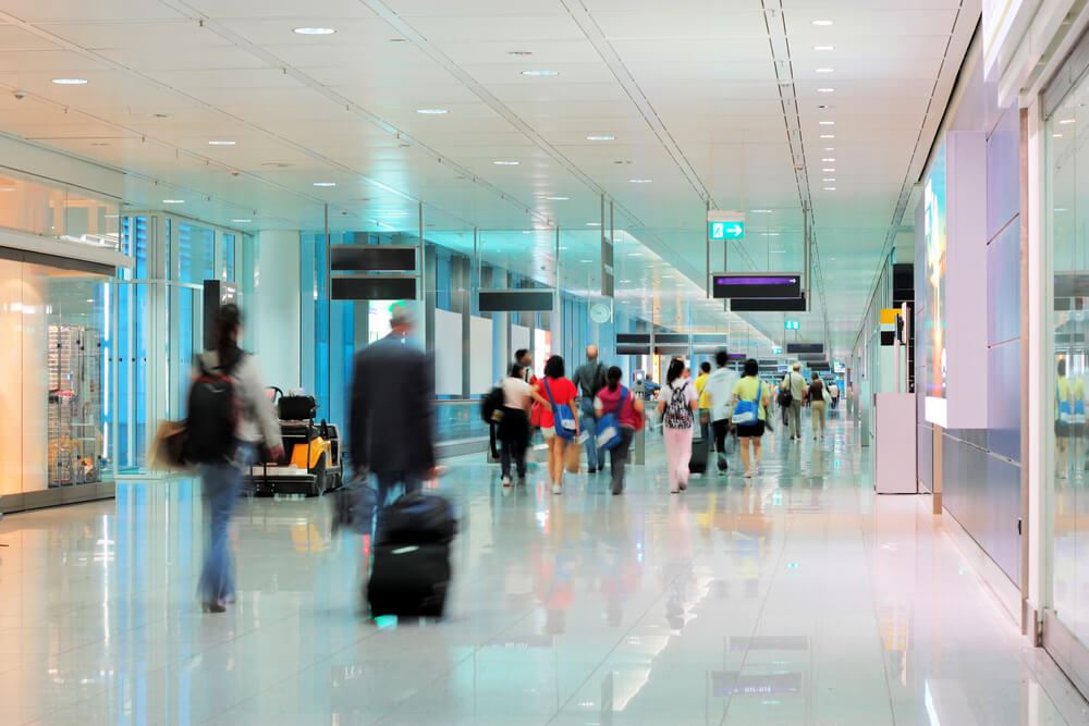 People walking through a busy airport