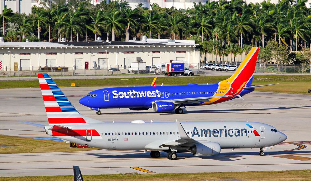Southwest airlines plane and american airlines plane on runway 
