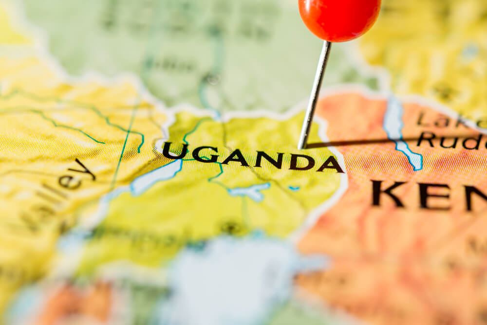 Photo of map with pin in the Uganda location 