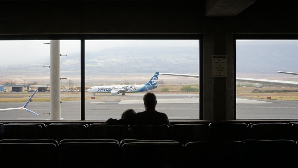 a couple waiting at Kahului Airport 