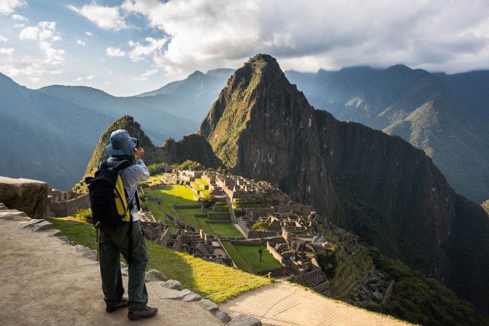 tourist taking photo at machu picchu